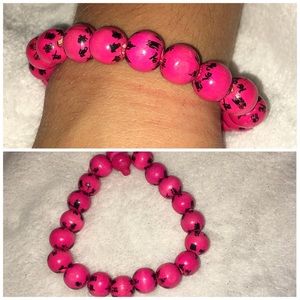 Wooden bead bracelet with Chinese symbols.